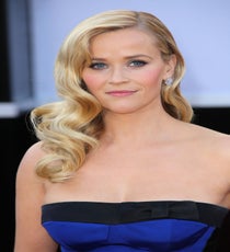Reese Witherspoon’s Sculpted Waves
Prefer to wear your hair down on your wedding day? Channel this Oscar presenter’s Old Hollywood glamour with side-swept sculpted waves. Perfect for wearing with a strapless gown, the Veronica Lake-inspired coiff flaunts the beautiful neckline and allows a dazzling earring to shine through. That’s what we call the best of both worlds. Photo: Jim Smeal/BEImages rexusa_1255640bb