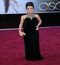 Salma Hayek
Three words: velvet and jewels. When in doubt, go for the old Hollywood classic (although honestly, we'd venture there was very little Hayek doubted about her McQueen dress). The almost-body-con fit and high-necked collar combined in one of the most regal gowns of the evening, but Salma being Salma, wore it with both power and sensuality. We love the simple gold clutch and Cindy Chao jewels she added on as well, which balanced the embellishment up top brilliantly.
Photo: Jim Smeal/BEImages
Salma Hayek 2013 Oscars