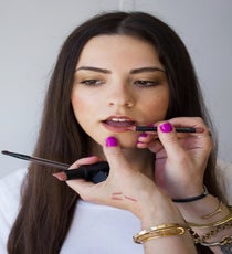 Step 8: Fill in the lip with a neutral liner and paint a golden gloss on top. You can also dab a bronzy highlight on the center of the lip for a more dramatic look.
Photographed by Christine Ting 11-Step7-1