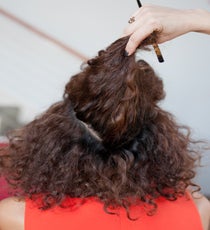 Step 6: Grab a section of hair in the back of the head, below the pompadour. 07_06_style1_step5