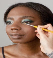 Using a super-sparkly metallic silver, push the color into the inner corner of the eyelid and wrap it just under the lower lash line. Blend the edges for a hazy effect. 26_HalloweenLook3_091512_201
