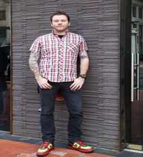 James Horn, general manager at Daikaya
Normally, we wouldn’t highlight two people from the same spot, but Daikaya is a hotbed for style. Horn is a fourth-generation restaurant pro and has done everything from cooking on the line to running the front of the house. He helped chef Mike Isabella launch Graffiato, then later dropped the managerial gig and moved to Bourbon Steak to toil on the line in the kitchen. Now, he’s back in a front-of-house role at Daikaya, where he helps bring Daisuke Utagawa’s intricate and unique hospitality vision to life on a daily basis.
Describe your personal style in a few words.
"Theoretically, I wear the same thing every day: jeans, T-shirt, and a blazer. I just change colors, patterns, and accessories. It's based on comfort, practicality, and what I like."
Where do you find inspiration for your style?
"I don't read a lot of magazines or style-based websites. I usually just see someone wearing something I think is cool and try to figure out how to get one."
Photographed by Maria Carey. 003_001_IMG_5127