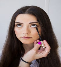 Step 7:
Finish the eye by adding black mascara to the top and bottom lashes. Use the end of the mascara brush to lightly build the bottom lashes.
Photographed by Christine Ting 09-Step6-1