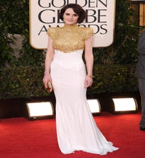 Michelle Dockery
Isn't it thrilling to finally see our beloved Mary in a modern-day frock? Michelle Dockery donned an Alexandre Vauthier gilt-and-white, cap-sleeved, absolute stunner, and she sweeps our sleek awards. We also adore the unexpected peeks of color in her burgundy Loubies and the bold, emerald Bulgari gems.
Photo: David Fisher/Rex/Rex USA Michelle-Dockery