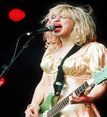 Courtney Love & Babydoll Dresses
Before Courtney Love, babydoll dresses were for, well, babies and dolls. Actually, their popularity crested during the late '60s, but the alternative music scene of the late '80s and early '90s latched on to them in an a way that was both ironic and genuine. Playing with and upturning preconceived notions of femininity, alt fans and groups wore the babydoll while moshing, sweating, and screaming their way through concerts — things Courtney Love excelled at. For a moment there, she was queen of the alts and her royal garb was, iconically, the babydoll.
Photo: Brian Rasic/Rex USA courtney-love