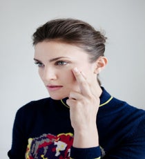 An all-over color stick is like the Swiss Army knife of makeup — it can literally do everything. Use it to add color to your lids and lips, and to sculpt and define the contours of your face. Since you will be applying this all over your face, Lake says to avoid really bright, garish colors or you will literally look like a clown. Stick to rosy pinks, bronzes, or warm peaches. She (like every other makeup artist, ever) swears by NARS The Multiple in Orgasm.
Dab a smudge of color on your fingertips and, starting at your temple, move in a C-formation from the temple to the top of your cheekbone, stopping in the center just before you hit the apples of your cheeks. Repeat on the other side.
Suno Sweater quick-beauty-20