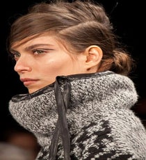 To show off the luxe knits of Rag and Bone's fall line, Guido used Redken Guts 10 volumizing foam, followed by Powder Refresh to add a hint of grit to the hair before pulling it back into an alterna-chignon. The extremely low side part creates a new, downtown-edgy mood to an otherwise classic style.
Photographed by Sara Kerens rag-and-bone-photoshop
