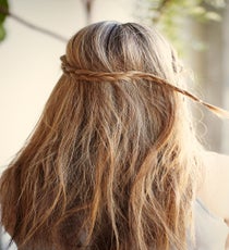 Step 3: Wrap the first braid from left to right across the back of the head and secure with a bobby pin. style4_step3
