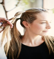 Step 4: Separate the ponytail into two equal parts. Then, twist both pieces to the right while cross-wrapping the right side over the left. style1_step4
