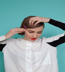 Finish the look by placing a small stack of colored bobby pins as an accent, right at eye level. The flat side of the bobby pins should face outward. bun-7
