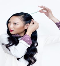 Pull back the hair on the side of your head where the part is focused and twist it loosely, then use a pin to secure the hair down behind your ear. sleek-waves-5