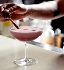 Last year, Todd Thrasher, drinks savant for EatGoodFood Group, had a dream about Showtime character Dexter Morgan’s serial-killer ritual. And while it sounds more like a nightmare to us, it inspired one dangerously good cocktail at PX. "The Dexter" combines pomegranate juice, orange juice bitters, 42 Below vodka, cardamaro (an Italian digestif), and egg white into a drink so juicy and delicious, you might not think there’s any alcohol in it at all. But, trust us — there is. The final touch is the stripe and drops of "blood" — pomegranate reduction — on top, which are a nod to (brace yourself, people!) Dexter’s habit of slashing his victims and saving their blood on slides as a memento. If good drinks could kill, well, we’d all be done for.
Where: 728 King Street, Alexandria; 703-299-8385.
Photographed by Lisa Mathias/A Whisk and a Mile PX_TheDexter3_LisaMathiasAWhiskAndAMile