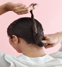 Continue twisting the hair into a loose figure-eight. It should be a bit droopy and hanging down. Pin in place. LowBun_147_R