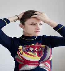 Use your fingers to gently mess up the front, teased section. Rake your fingers back through it to give it volume and texture and to keep it from looking like a full-on pompadour. Tuck and pin any flyaways, then spray your whole head with a workable hairspray, like Bumble and bumble Spray de Mode.
Suno Sweater quick-beauty-19