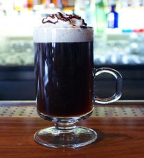 The Hot Cubano
1 1/2 ounces dark rum
1/2 ounce coffee liqueur
1 shot strong Cuban espresso
Whipped cream
Powdered/shaved chocolate
Cinnamon
Pour the dark rum and coffee liqueur into a coffee glass or mug; fill with strong Cuban espresso. Top off with a dollop of whipped cream and garnish with a sprinkle of cinnamon and powdered/shaved chocolate.Photo: Courtesy of LFB Media Group TheHotCubano
