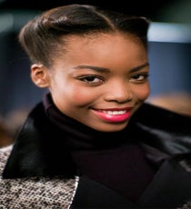 To watch Orlando Pita create this incredible '40s Gibson roll look backstage (with the help of Moroccanoil products) was like watching a sculptor at work on his masterpiece. Starting at the part, the hair was meticulously rolled back and then tucked in, to create a sleek yet romantic updo that perfectly accented Herrera's dramatic collection.
Photo: Jesse Lirola/BFAnyc.com carolina-photoshop